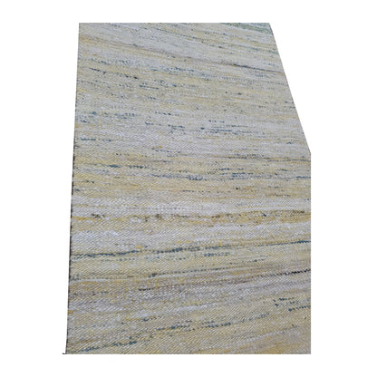 Close-up of Indian Dhurrie runner showing off-white, pale blue, beige and muted yellow horizontal weave