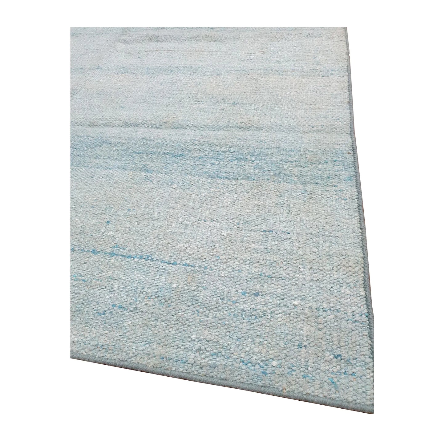 Edge detail of Indian Dhurrie rug showing pale blue woven texture and fine horizontal striations
