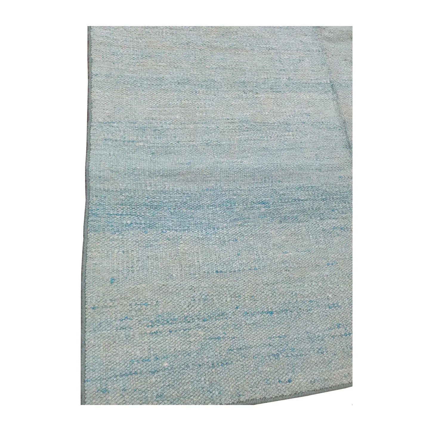 Close-up of Indian Dhurrie rug showing light blue and off-white tonal bands across the flatwoven surface
