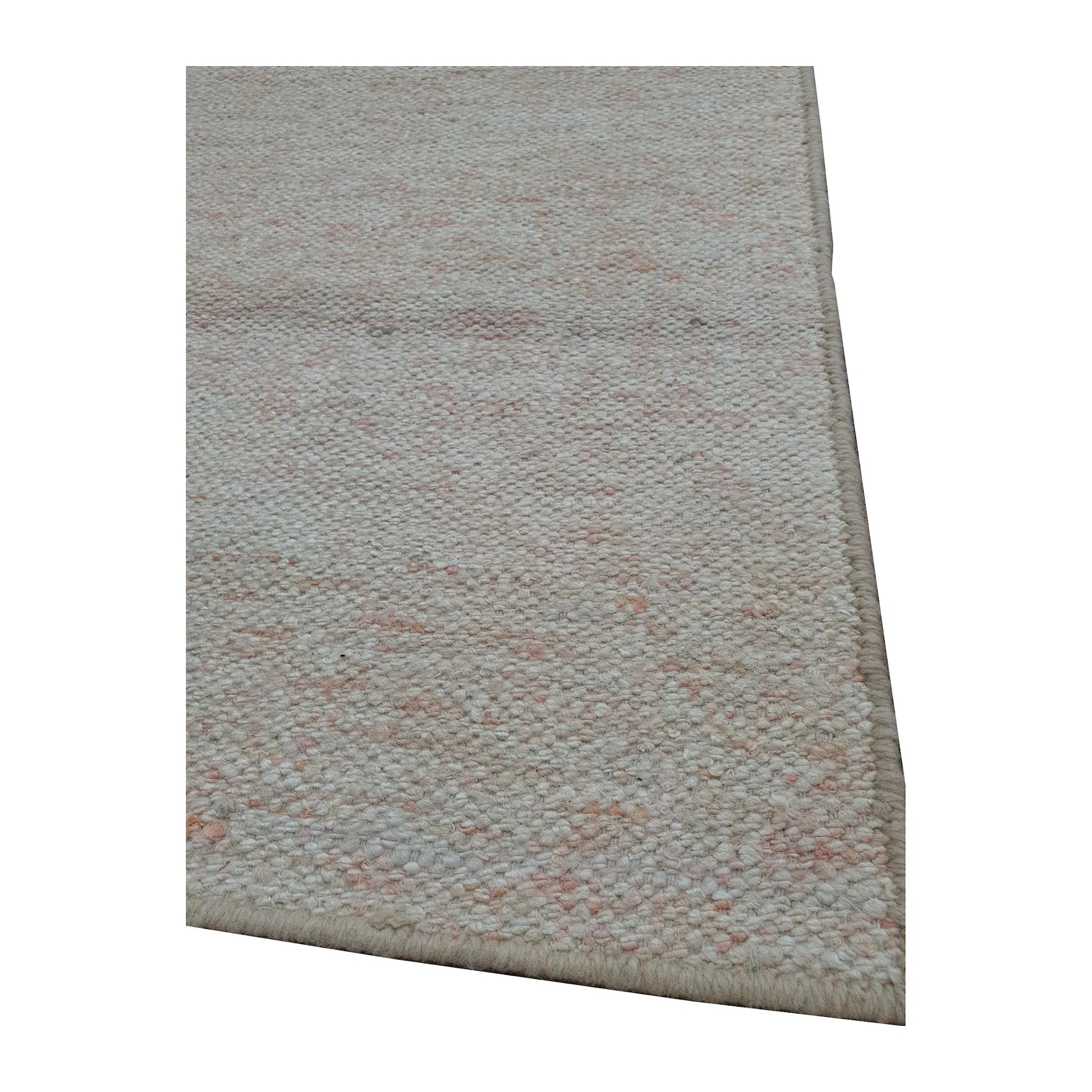 Edge detail of Indian Dhurrie runner showing off-white flatweave texture with subtle pale peach variation