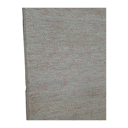 Close-up of Indian Dhurrie runner showing pale peach flecks across the off-white woven surface