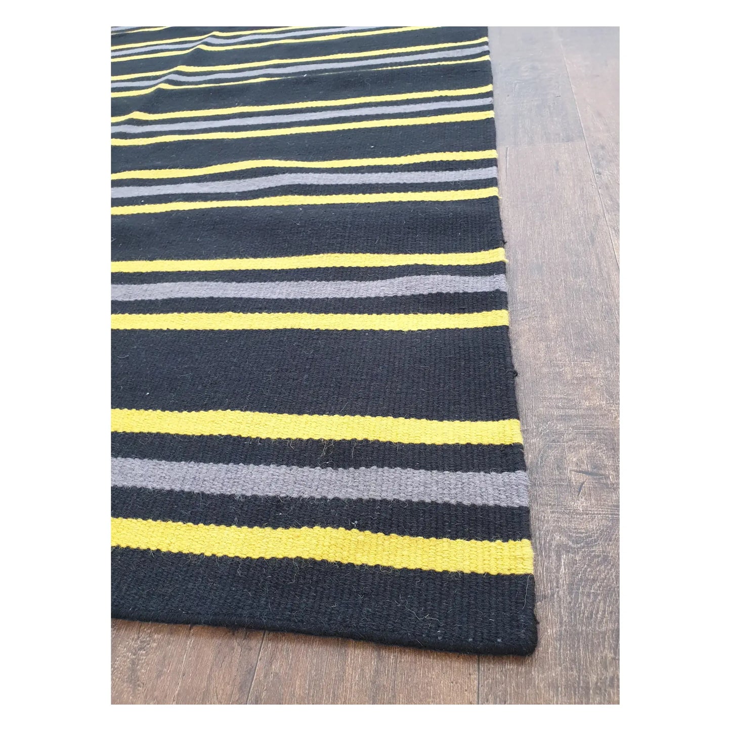 Angled detail of Indian Dhurrie rug showing fine wool flatweave texture and multicolour stripe pattern, 230 x 160 cm
