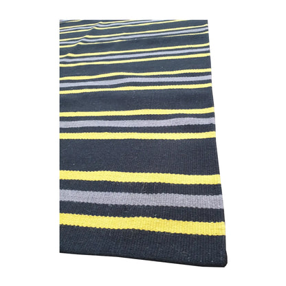 Angled detail of Indian Dhurrie rug showing fine wool flatweave texture and multicolour stripe pattern, 230 x 160 cm
