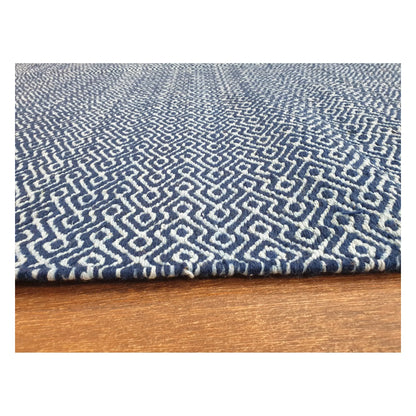 Low-angle close-up of Indian Dhurrie rug with blue geometric weave and flatweave texture, 230 x 160 cm