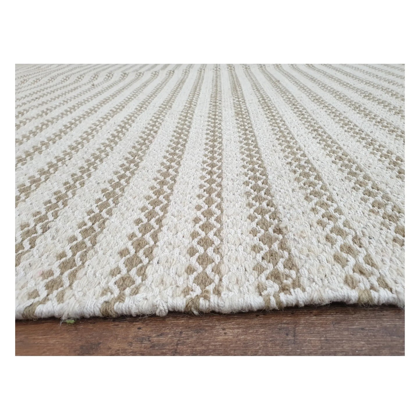 Low-angle close-up of Indian Dhurrie rug with textured limestone AB-10 design, 290 x 200 cm