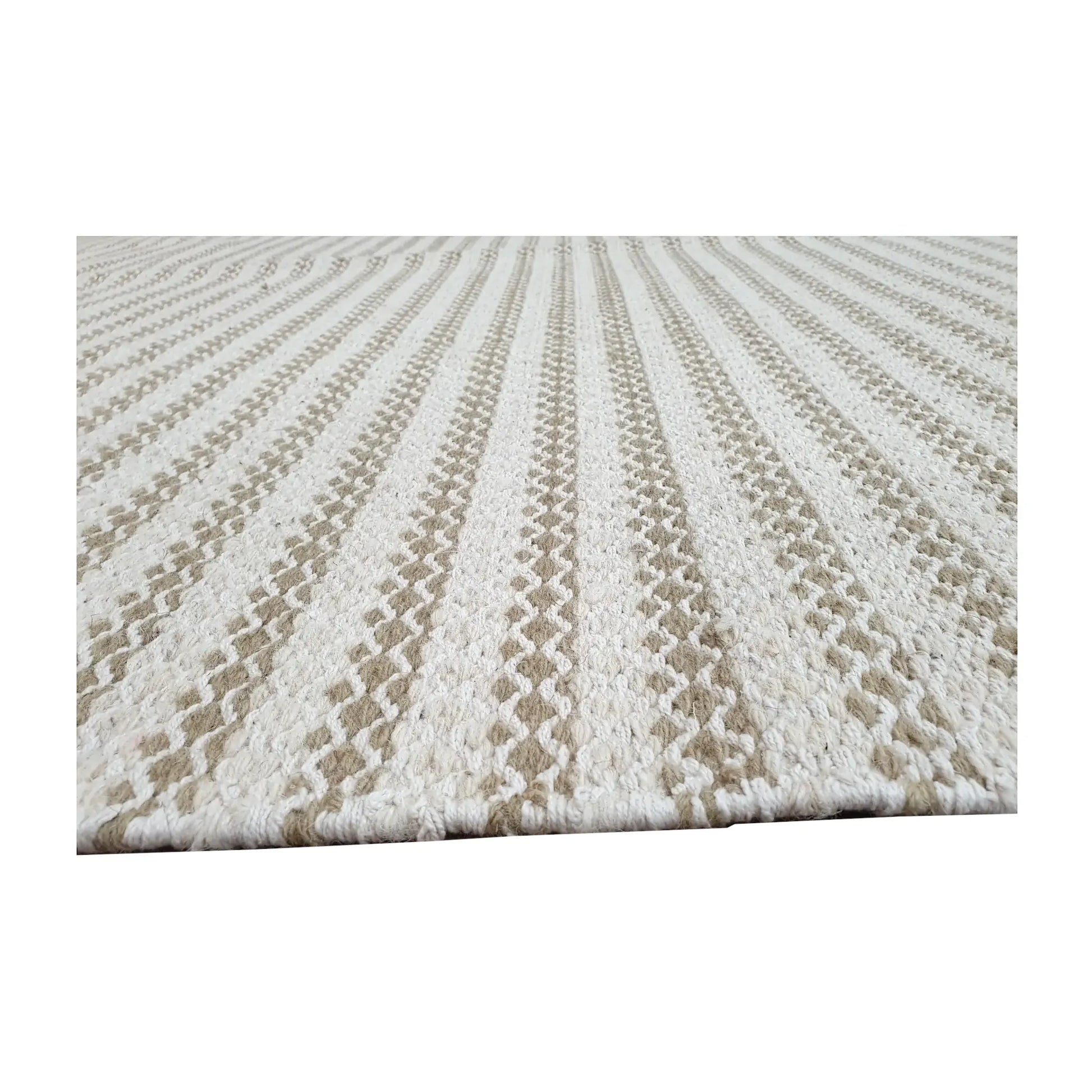 Low-angle close-up of Indian Dhurrie rug with textured limestone AB-10 design, 290 x 200 cm