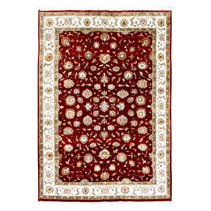 Full view of Indian Ziegler wool and silk rug with deep red floral field and broad ivory border, 300 x 198 cm