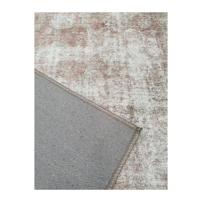 Close-up of ivory blush cotton rug corner with back and edge detail