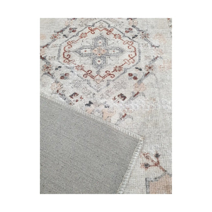 Close-up of ivory blush cotton rug corner with back and edge detail