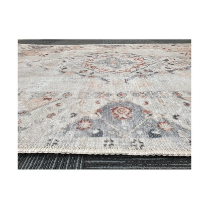 Low-angle close-up of ivory blush cotton rug edge and woven surface texture