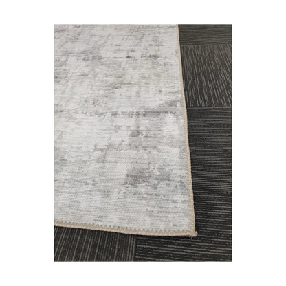 Close-up of ivory grey cotton rug corner with edge and surface detail