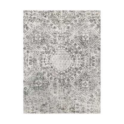 Close-up of ivory grey cotton rug central medallion and ornamental floral pattern