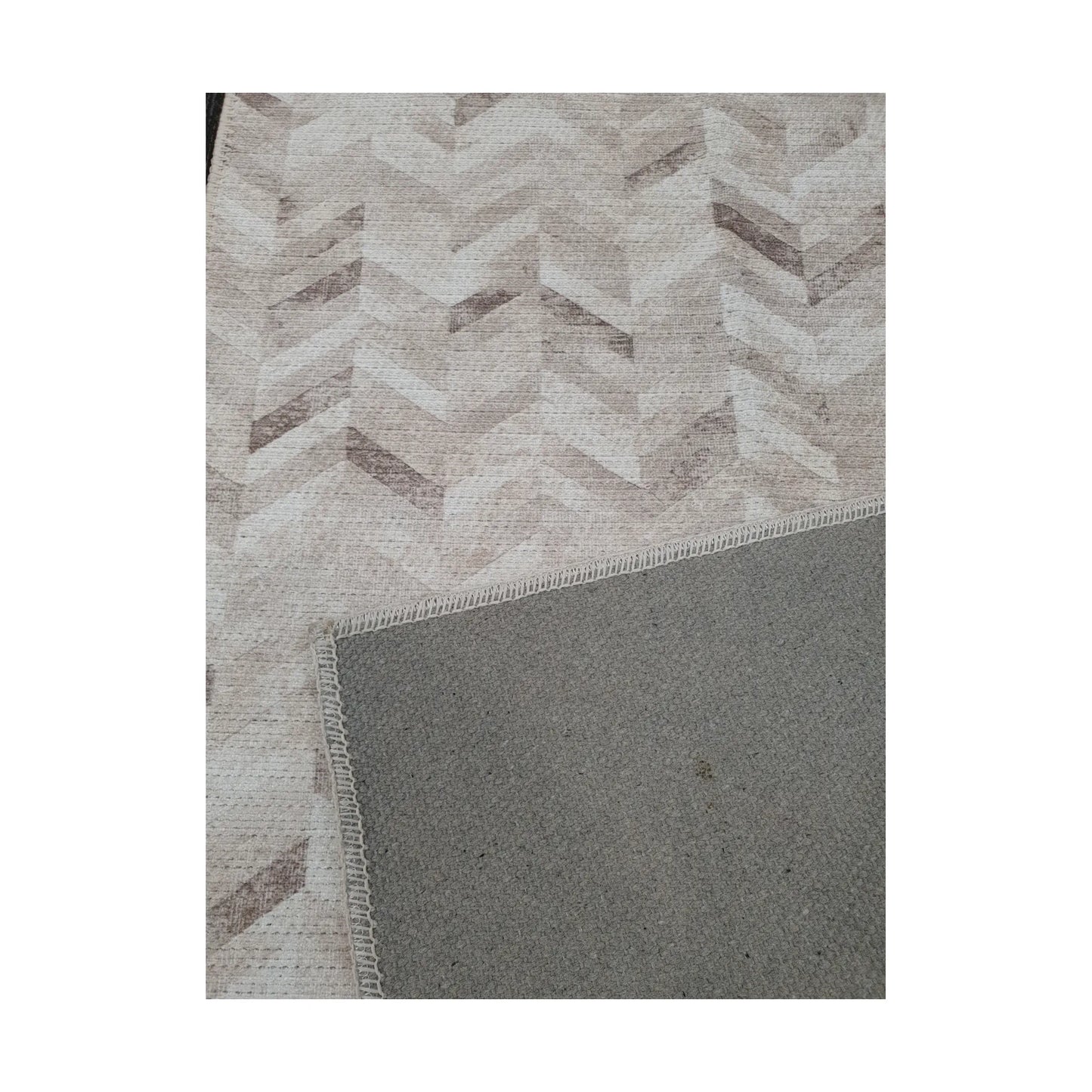 Close-up of ivory grey cotton runner rug corner with back and edge detail