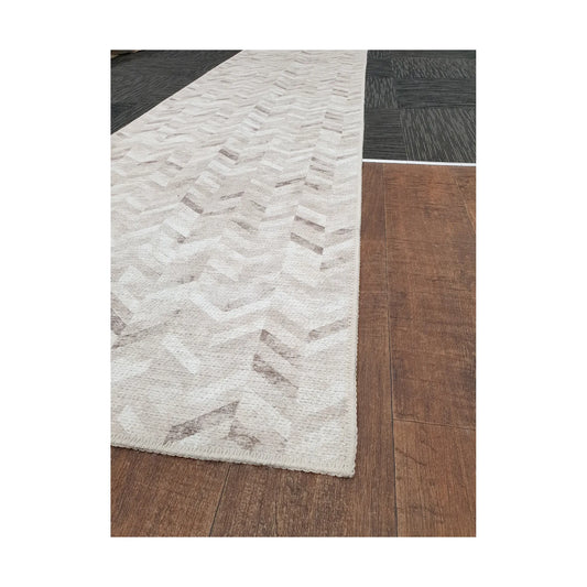 Close-up of ivory grey herringbone cotton runner rug corner and edge detail