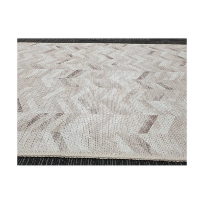 Low-angle close-up of ivory grey herringbone cotton runner rug edge and woven texture