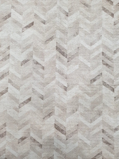 Close-up of ivory grey cotton runner rug herringbone geometric pattern