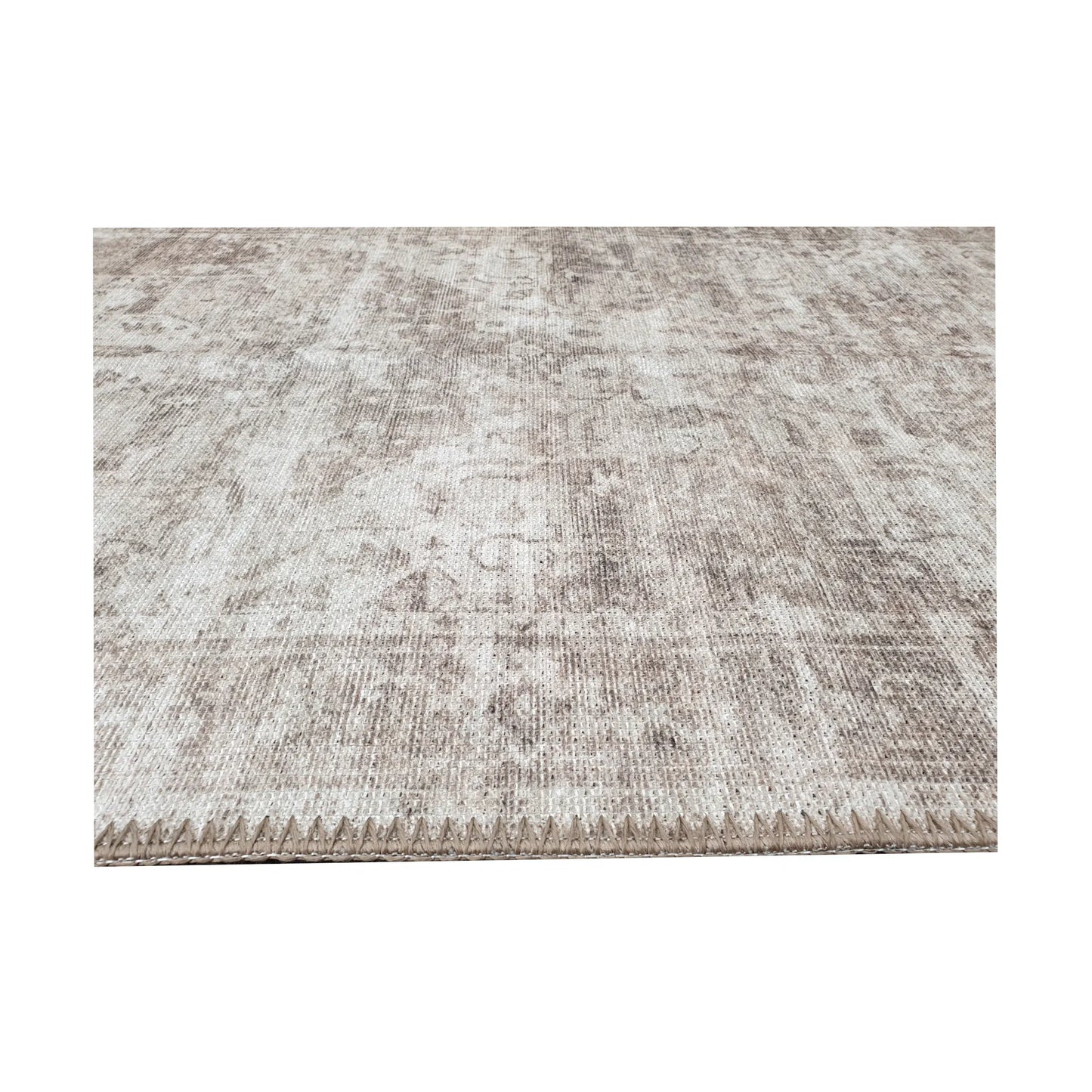 Low-angle close-up of ivory grey cotton runner rug edge and woven surface texture