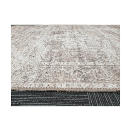 Low-angle close-up of ivory grey cotton rug edge and woven surface texture