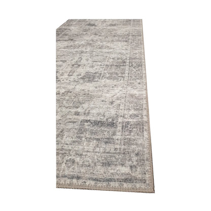 Close-up of ivory grey cotton runner rug corner with subtle ornamental edge detail
