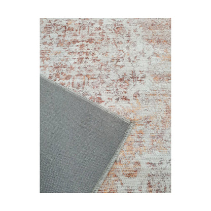 Close-up of ivory rust cotton rug corner with back and edge detail