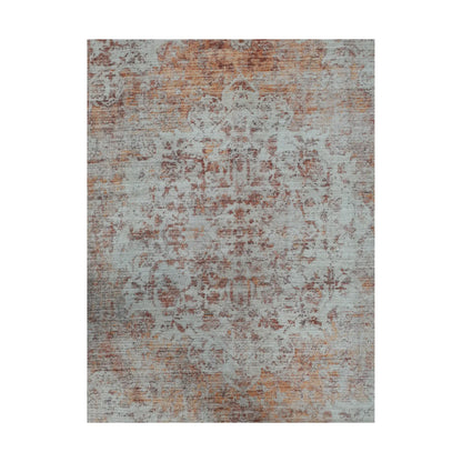 Close-up of ivory rust cotton rug faded abstract surface pattern