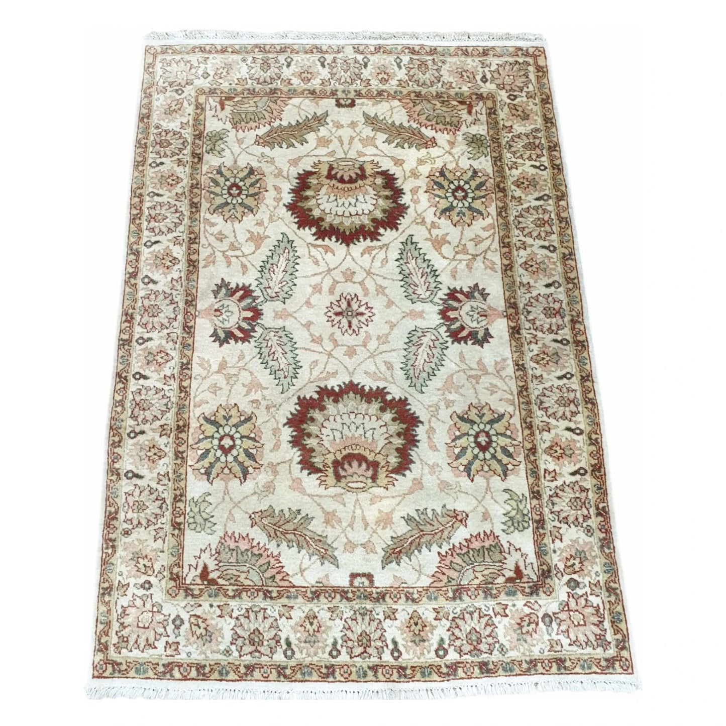 Angled full view of ivory rust Ziegler hand-knotted wool rug 178 x 130 cm with floral medallion design and muted green accents