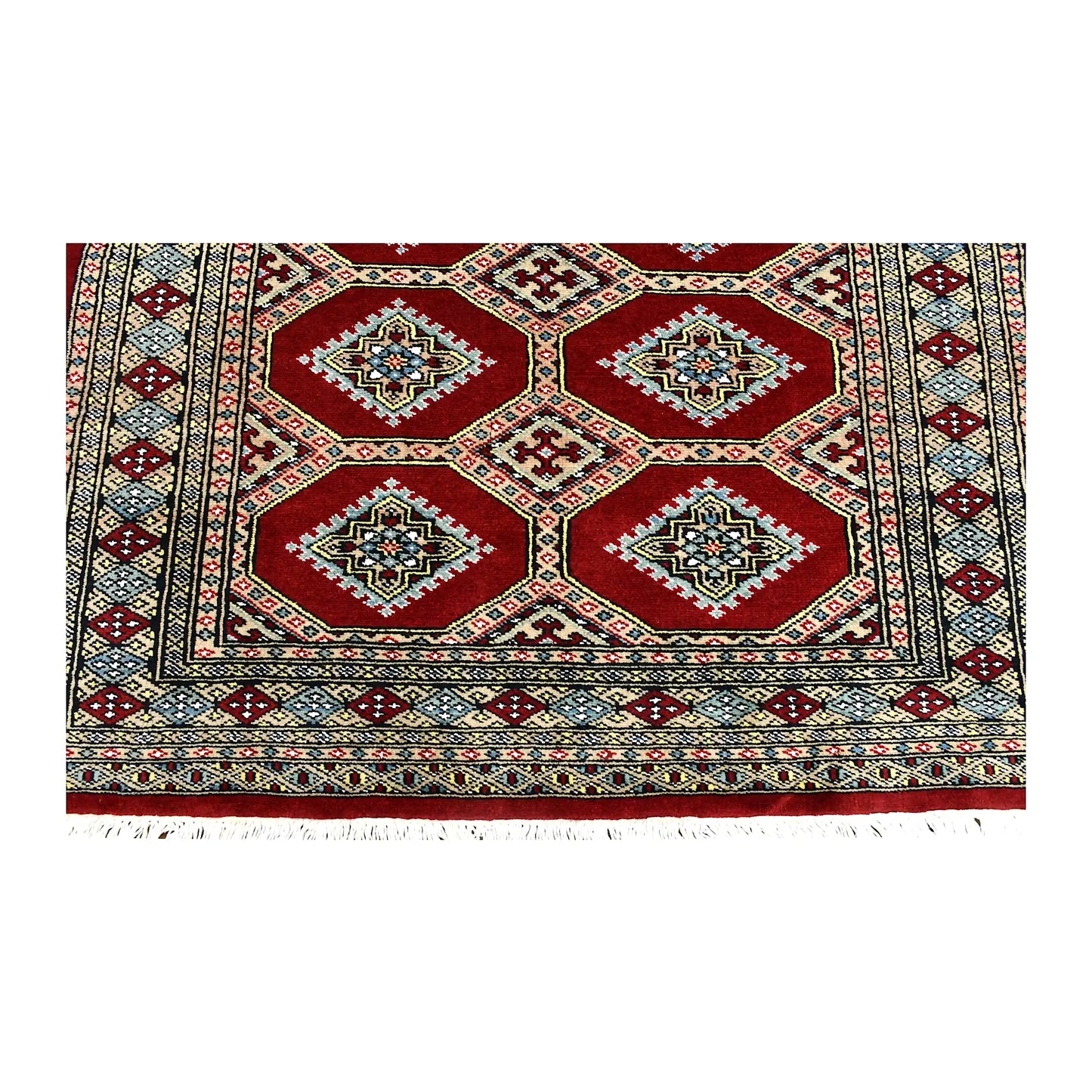 Fringe and end-border detail of Jaldar rug with deep red, ivory, muted blue and charcoal geometric motifs