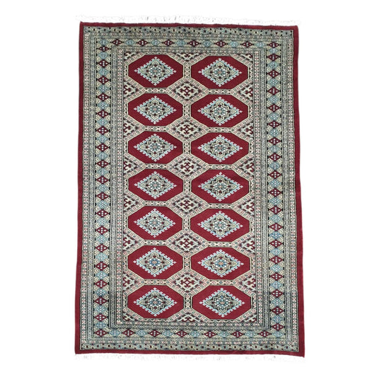 Full view of Jaldar hand-knotted wool rug with deep red octagonal panels, angular guls and layered borders, 191 x 122 cm