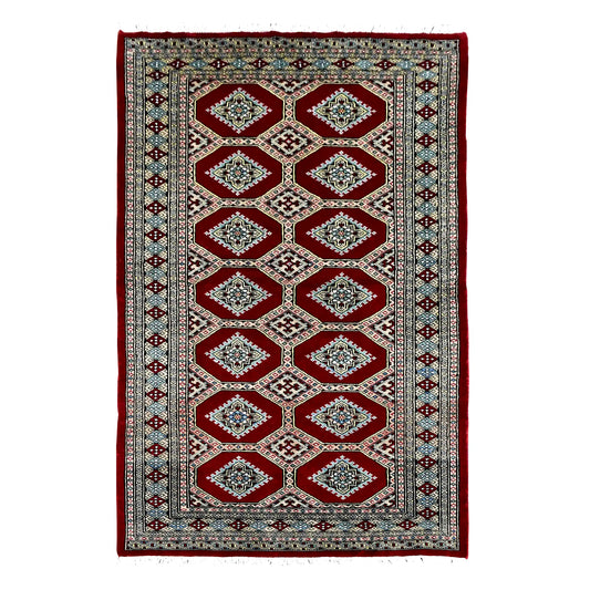 Full view of Jaldar hand-knotted wool rug with deep red octagonal panels, repeating angular guls and geometric borders, 191 x 122 cm