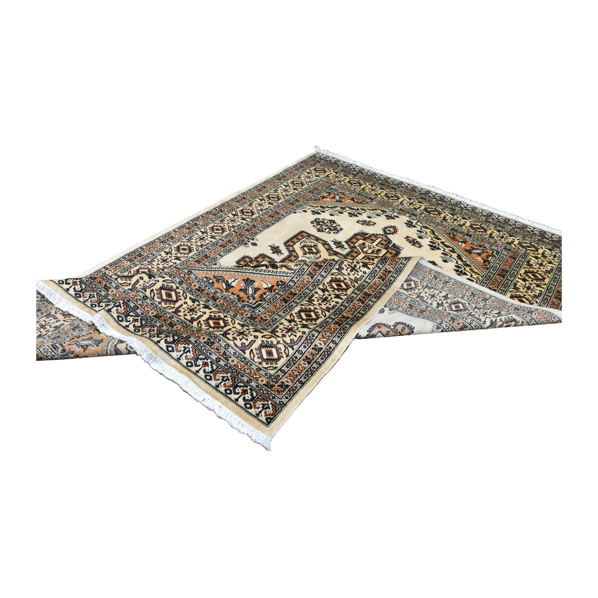 Folded view of Jaldar rug showing its medallion, layered borders, white fringe and a glimpse of the reverse