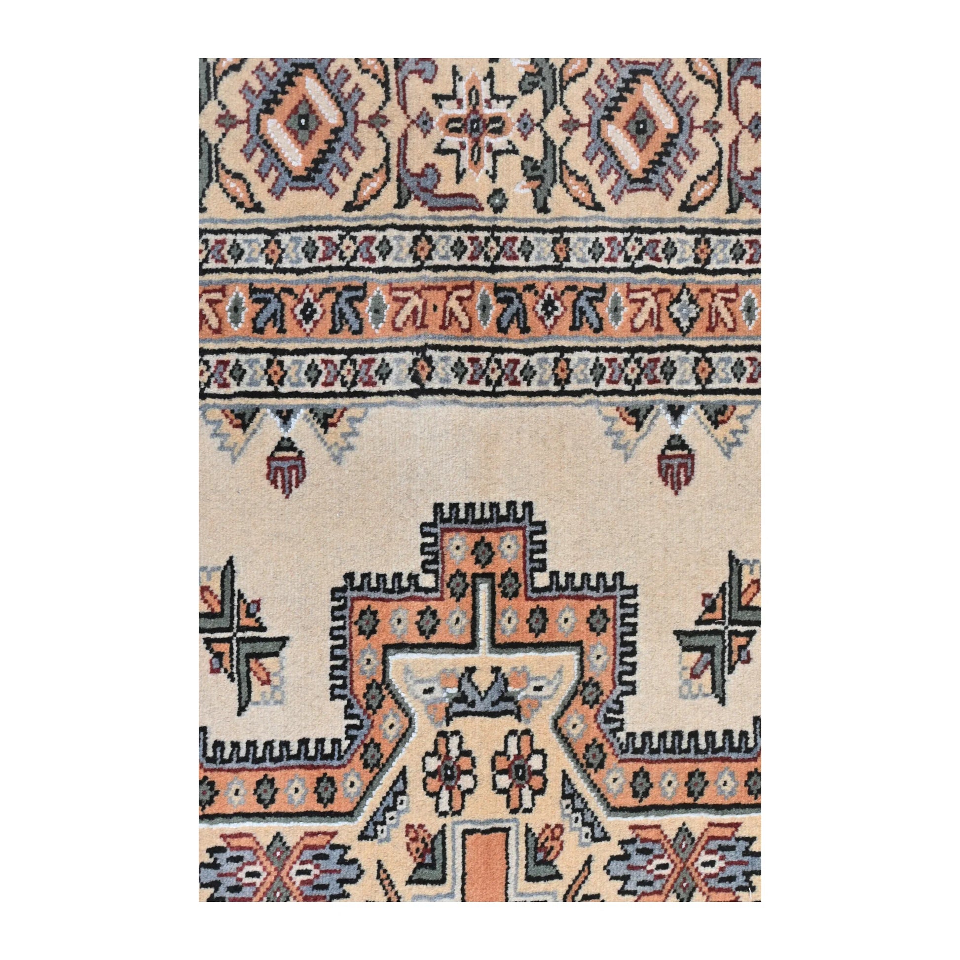 Close-up of Jaldar rug showing the central medallion edge, beige field and layered side border