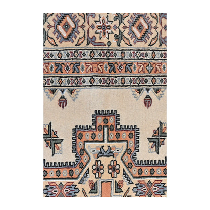 Close-up of Jaldar rug showing the central medallion edge, beige field and layered side border
