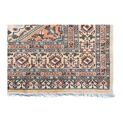 Close-up of Jaldar rug showing the patterned end border and visible fringe