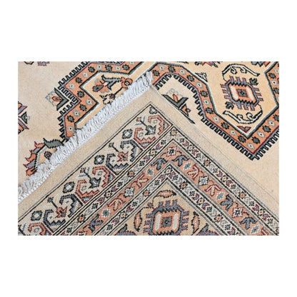 Folded corner detail of Jaldar rug showing the layered border, rug edge and geometric field pattern