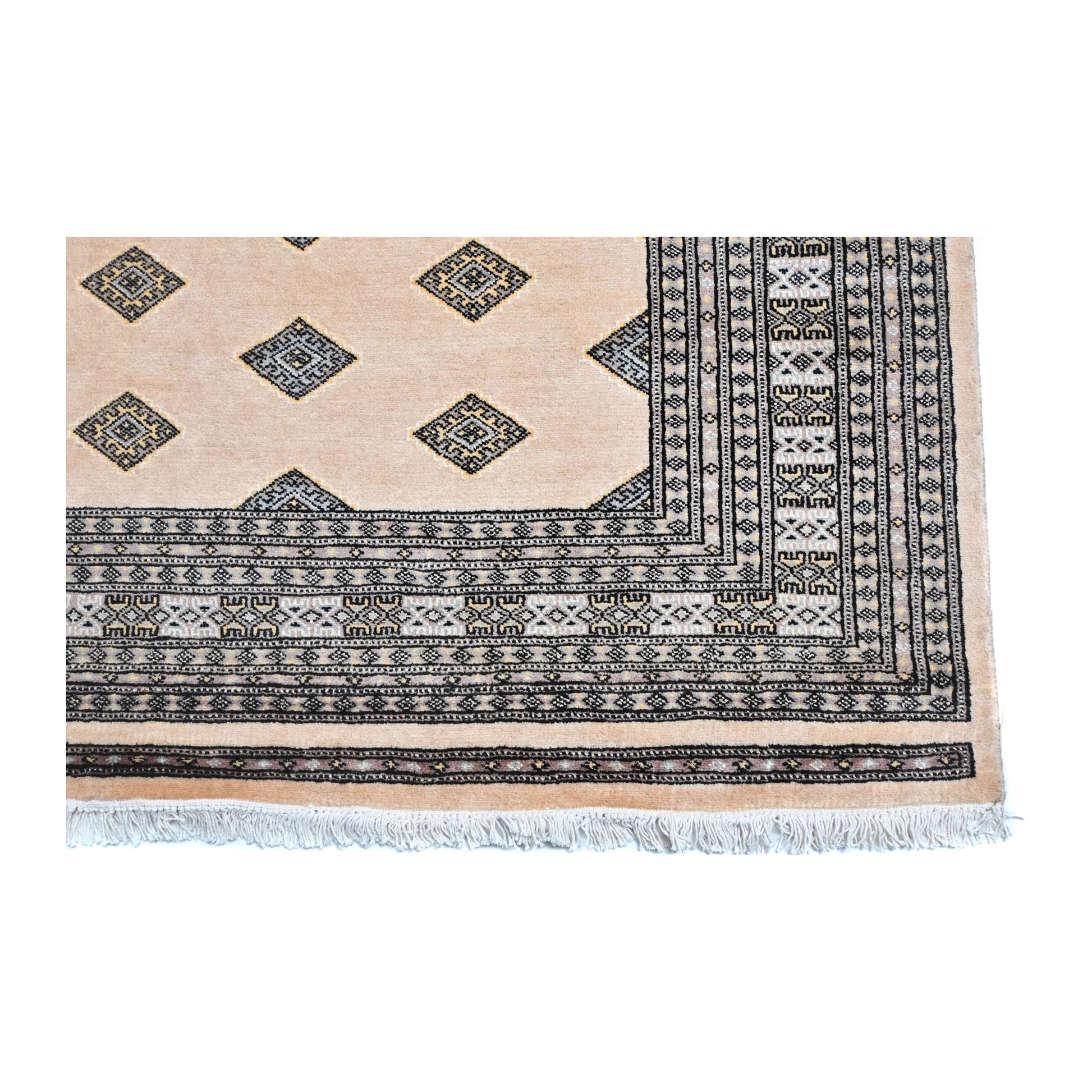 Close-up of Jaldar Silk Touch rug showing the patterned end border and visible fringe