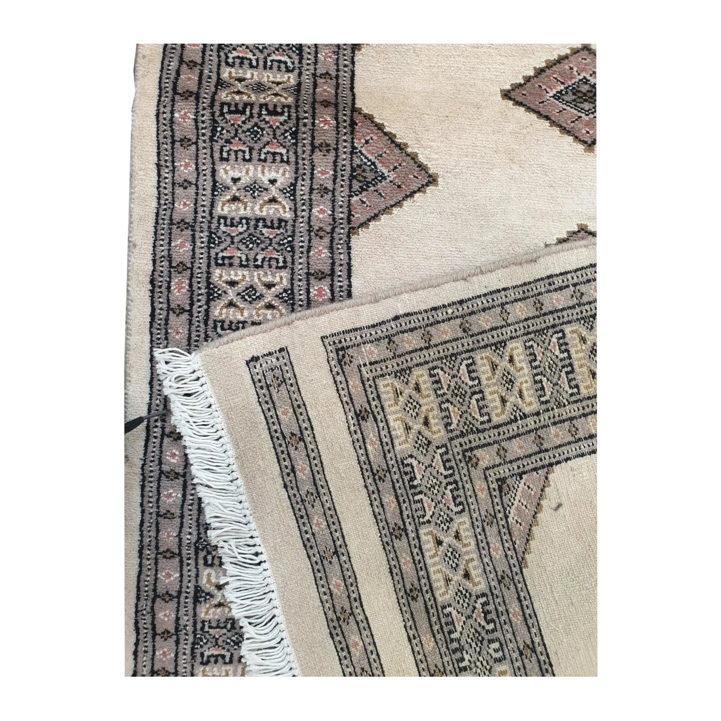Folded corner detail of Jaldar Silk Touch runner rug showing the border, fringe and reverse side
