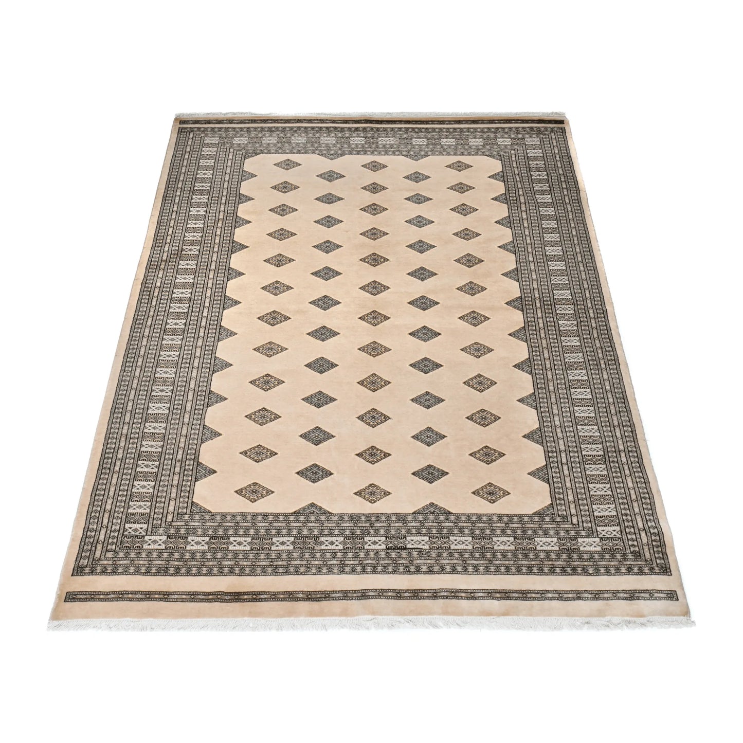 Angled full view of Jaldar Silk Touch wool and silk rug showing the beige field, repeating diamond guls and patterned borders