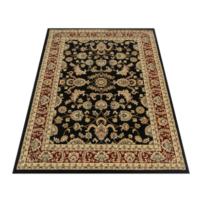 Angled view of Julian 90500 Black Red traditional rug showing black field, red border and ornate floral design