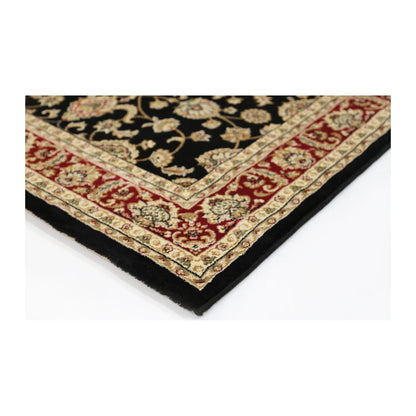 Corner detail of Julian 90500 Black Red traditional rug showing bound edge, red border and black patterned field