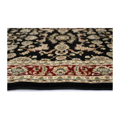 Close-up of Julian 90500 Black Red rug showing polypropylene pile texture, floral detail and traditional border pattern
