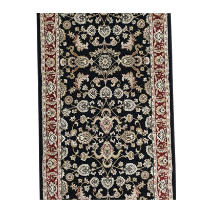 Field detail of Julian black runner rug showing ivory floral motifs and vinework
