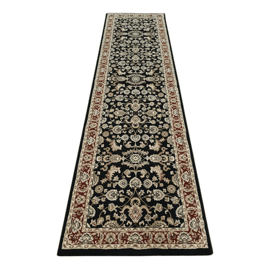Full view of Julian black machine-made runner rug with floral motifs and red border