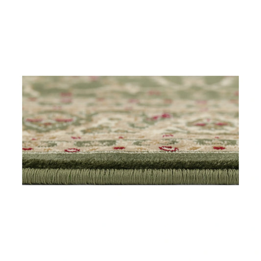 Close-up of Julian Traditional Designer Green rug showing edge detail, polypropylene pile texture and soft green tones, 290 x 200 cm