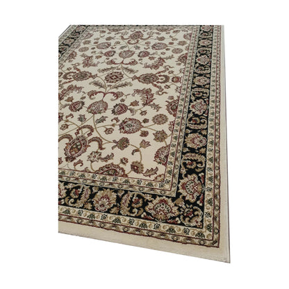 Corner border detail of Julian Traditional Rug with cream floral field, black border and beige edge