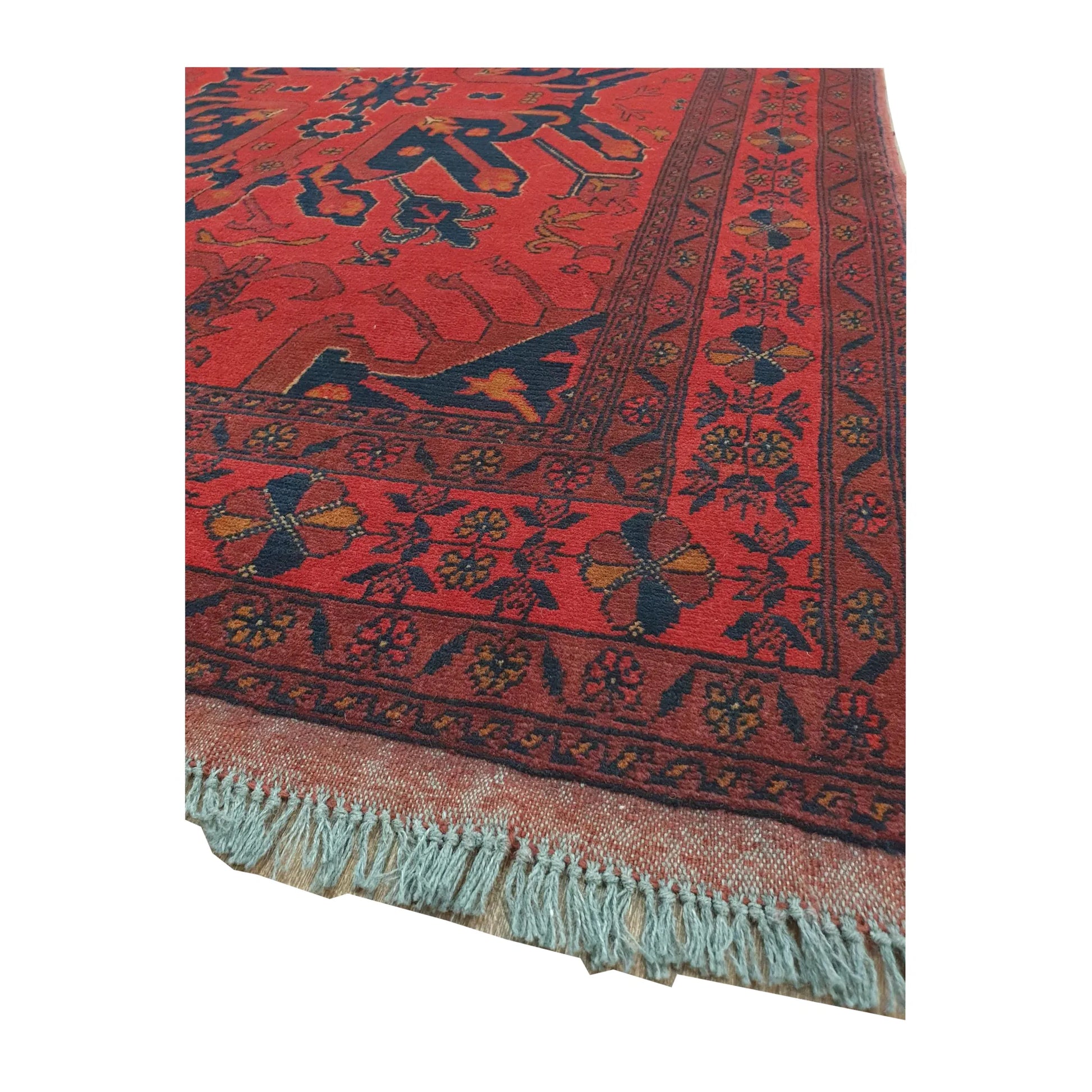 Close-up of Khal Mohammadi rug showing the red and navy border corner with visible fringe