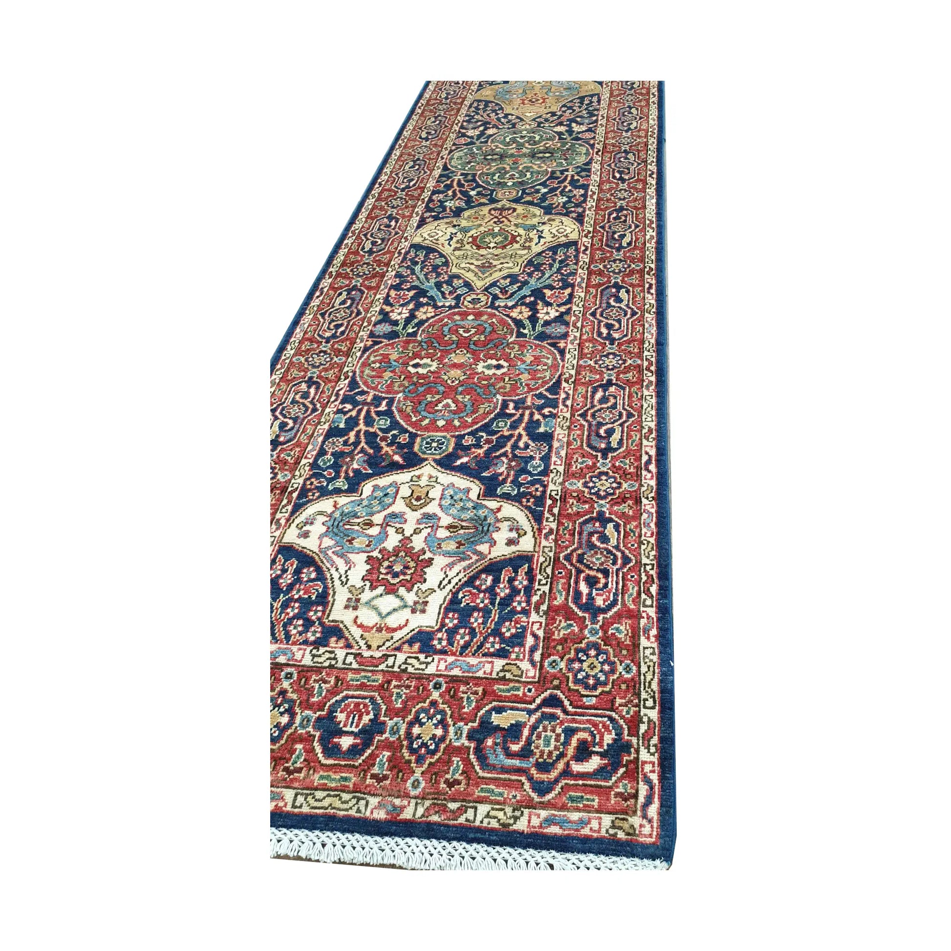 Close-up of Khurjeen wool runner rug showing border detail, tribal pattern and hand-knotted texture
