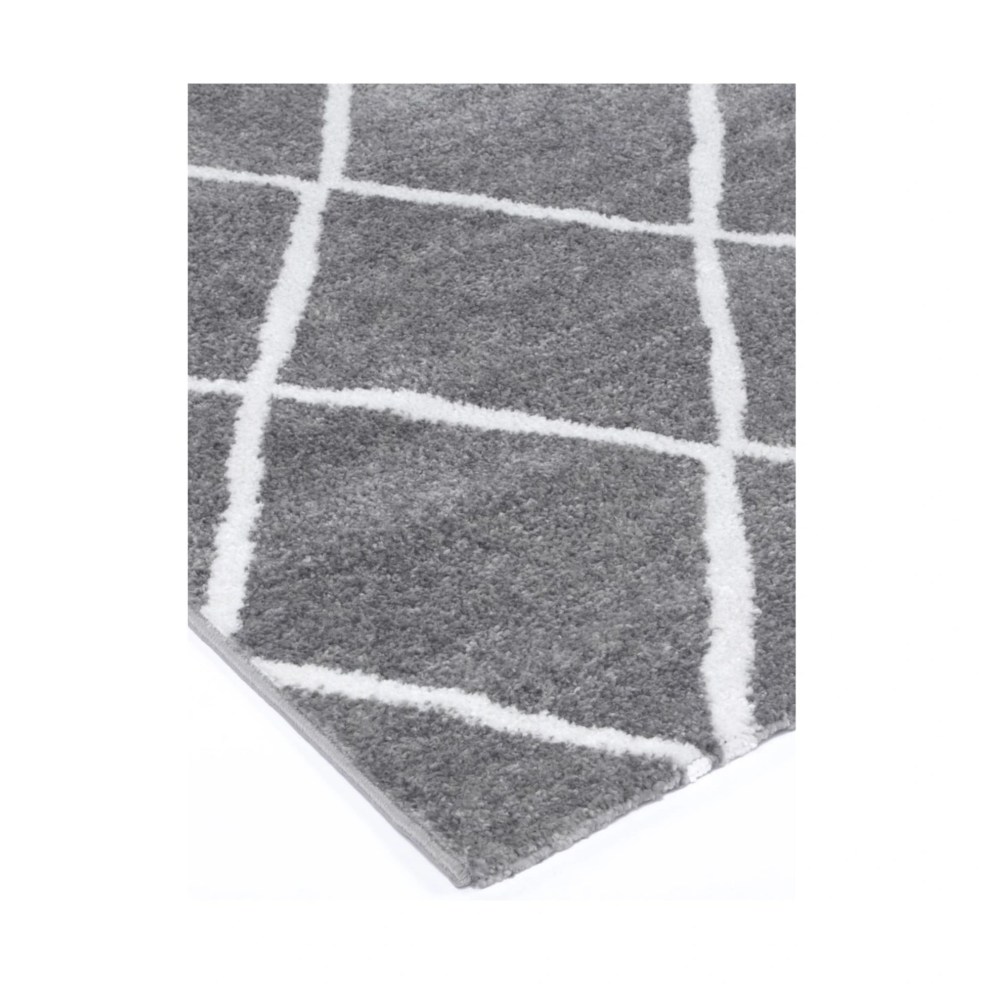 Corner detail of Kimberley 1 Trellis Grey Rug showing grey field and white trellis pattern