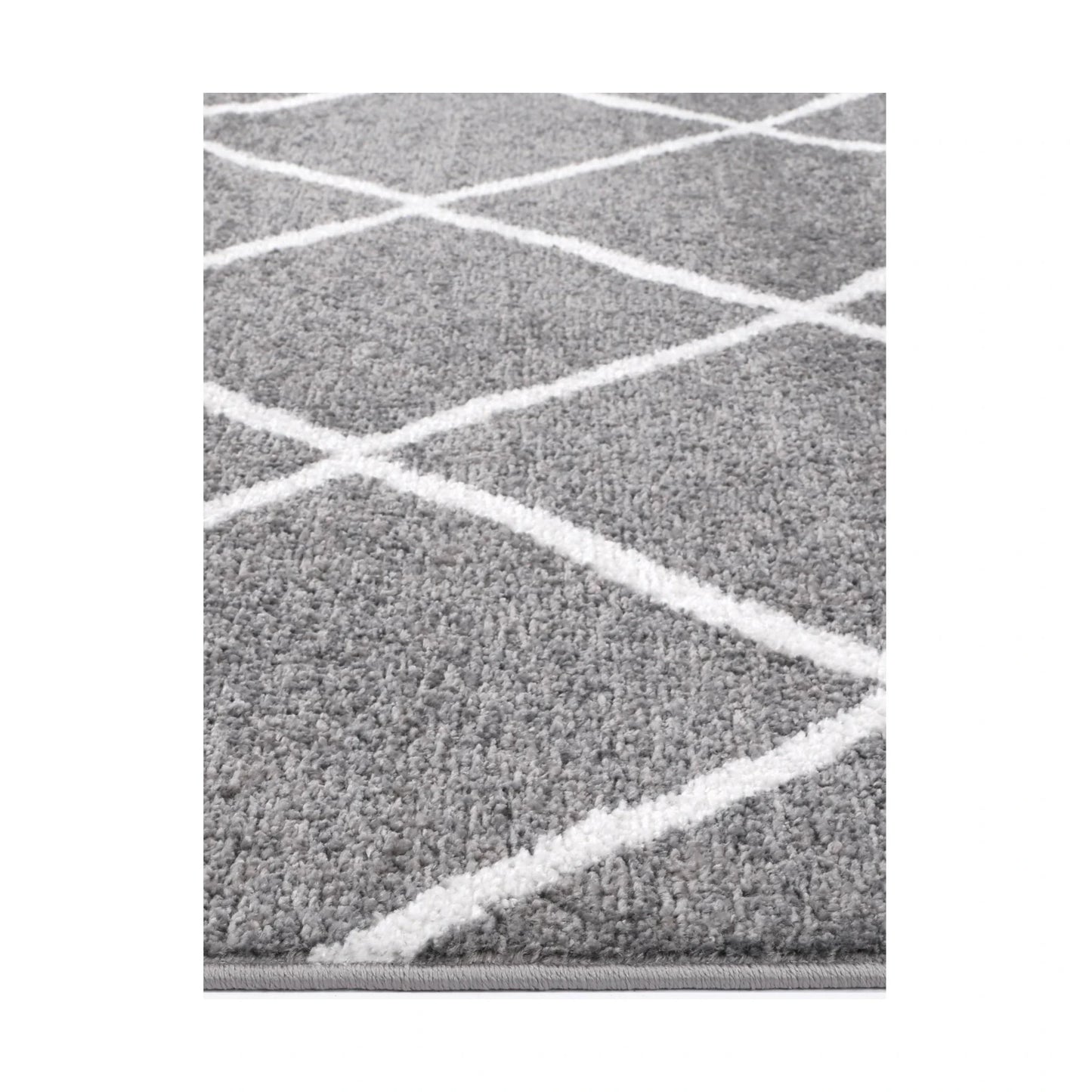 Edge detail of Kimberley 1 Trellis Grey Rug with raised white geometric lines