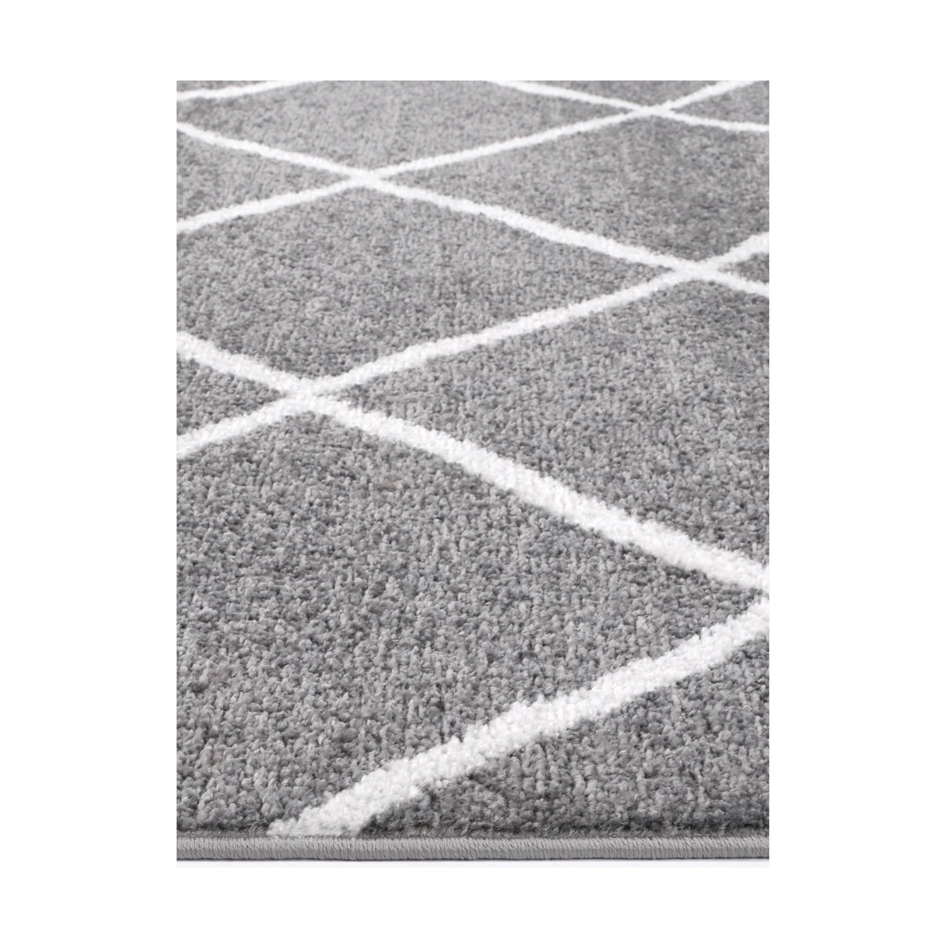 Edge detail of Kimberley 1 Trellis Grey Rug with raised white geometric lines