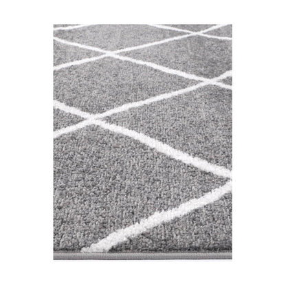 Edge detail of Kimberley 1 Trellis Grey Rug with raised white geometric lines